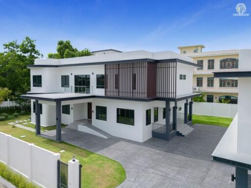 Modern two-story house with a driveway and lawn