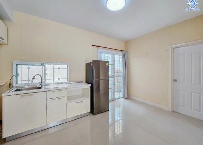 Modern kitchen with large fridge and sink