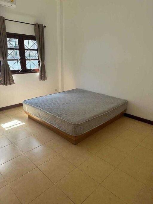 Empty bedroom with a mattress on the floor