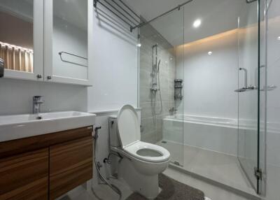 Modern, clean bathroom with fixtures and glass shower