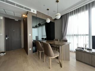 Modern dining room with wooden furniture and large windows