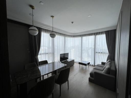 Modern living room with large windows and natural light