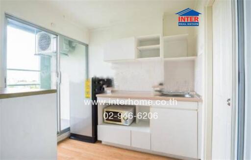 Modern kitchen with white cabinets and appliances