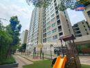 High-rise residential building with playground area