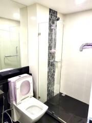 Modern bathroom with glass shower and toilet