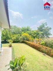 Spacious backyard with a lawn and garden