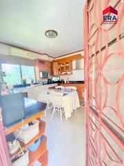 Bright and spacious kitchen with modern appliances and dining area