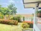 Backyard with tile floor patio and garden view