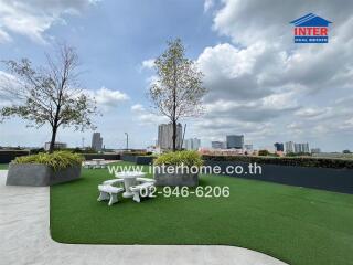 Spacious roof terrace with seating area and city views