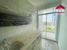 Modern kitchen with balcony access in Chonburi