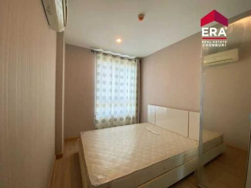 Modern bedroom with window and air conditioning