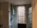 Bathroom with shower and window blinds