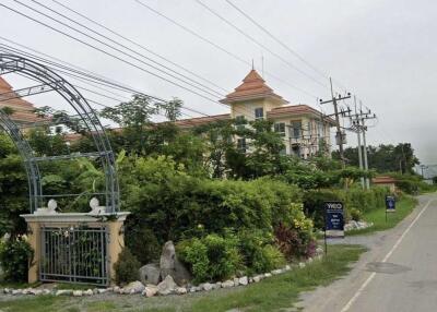 Exterior view of a residential building with greenery