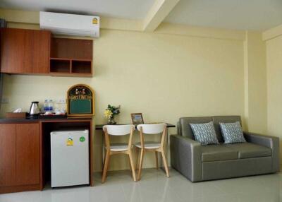 Living area with kitchenette and seating