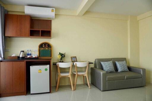 Living area with kitchenette and seating
