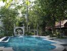 Outdoor swimming pool with garden and pavilion