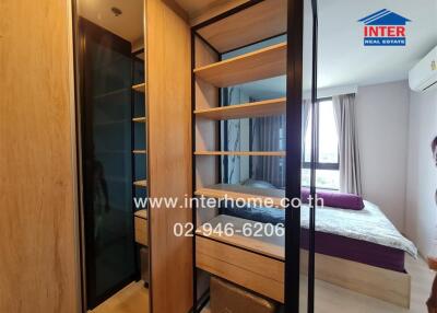 Bedroom with a built-in wardrobe and a bed near a window