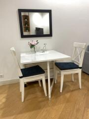 Cozy dining area with a table and two chairs