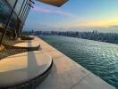 High-rise building rooftop infinity pool with cityscape view