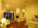 Well-lit living area with hardwood floors and modern furnishings