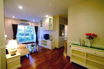 Bright and cozy living room with wooden flooring and city view