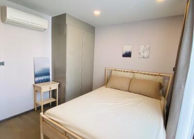 Well-lit bedroom with minimalist decor