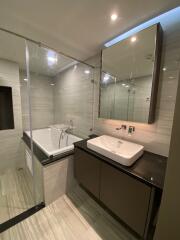 Modern bathroom with bathtub and vanity