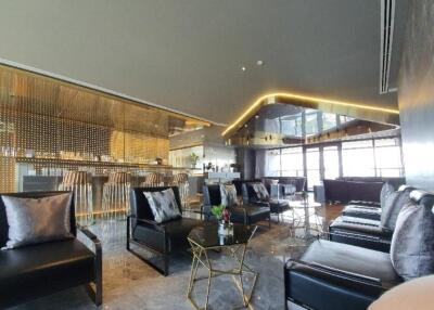 Modern luxury lounge area with bar and seating