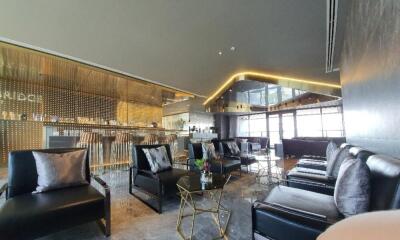 Modern luxury lounge area with bar and seating