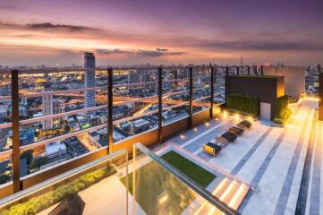 Rooftop terrace with city view at sunset
