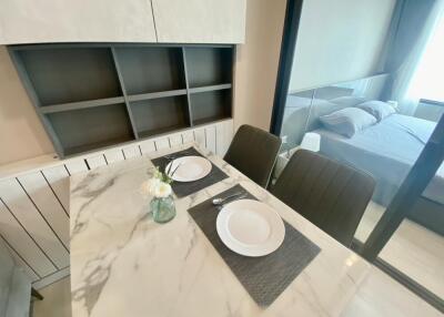 Modern dining space with marble table and chairs