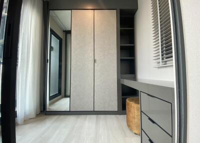 Modern, clean bedroom with wardrobe and desk