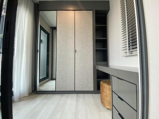 Modern, clean bedroom with wardrobe and desk