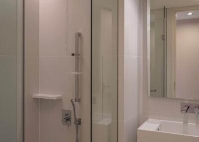 Modern bathroom with glass shower enclosure and vanity