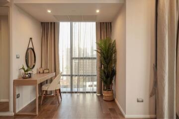 Cozy bedroom with a dressing table and indoor plant