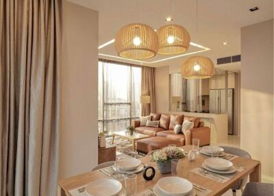 Modern living and dining area with contemporary furniture and warm lighting