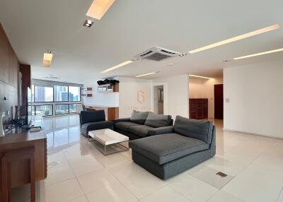 Modern and spacious living room with a view of the city