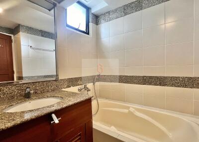 Modern bathroom with vanity and bathtub