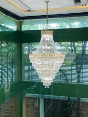 Hanging chandelier in a glass-walled building