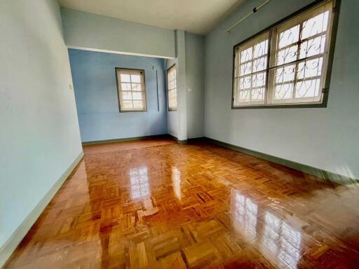 Spacious bedroom with large windows