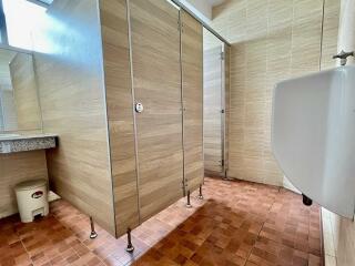 Modern bathroom with stall and urinal