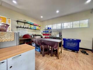 Spacious kitchen with storage and dining area