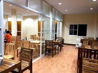 Spacious dining area with wooden furniture