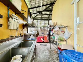 Outdoor kitchen with various kitchen appliances and storage