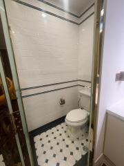 Modern bathroom with white subway tiles and black accents