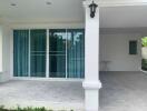 Covered patio area with sliding glass doors