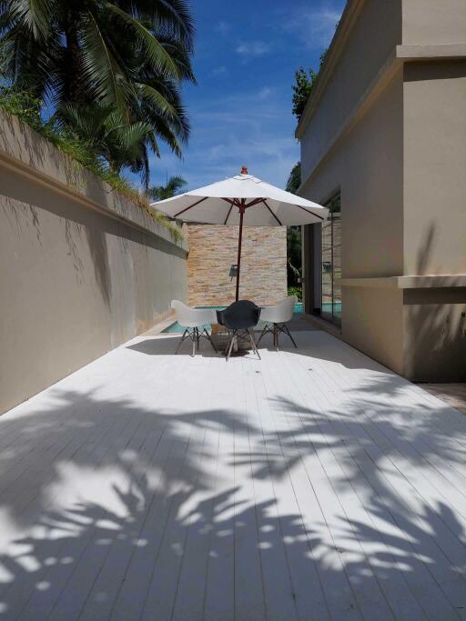 Outdoor dining area with umbrella