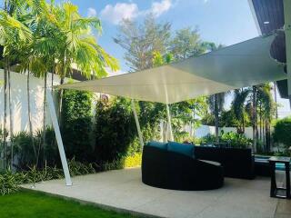Modern outdoor patio with shade sail