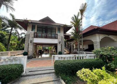 Two-story house with garden and driveway