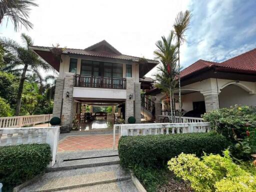 Two-story house with garden and driveway